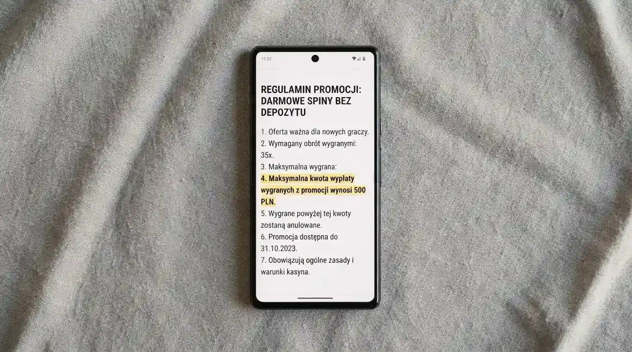 Smartfon z otwartym regulaminem promocji i zaznaczonym limitem wygranej z bonusu